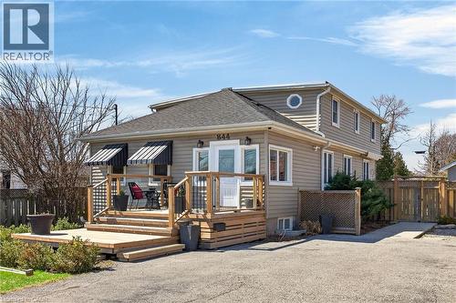 View of front of home featuring a wooden deck and roof with shingles - 844 Upper Wellington Street, Hamilton, ON - Outdoor