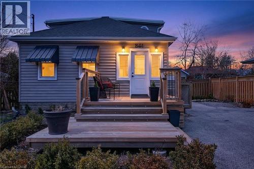 View of front of home with a shingled roof and a wooden deck - 844 Upper Wellington Street, Hamilton, ON - Outdoor