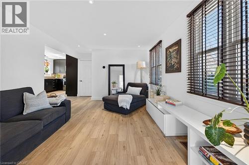 Living area with light wood-style floors and recessed lighting - 844 Upper Wellington Street, Hamilton, ON - Indoor Photo Showing Living Room