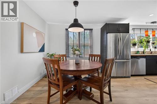 Dining room with light wood finished floors and baseboards - 844 Upper Wellington Street, Hamilton, ON - Indoor Photo Showing Dining Room
