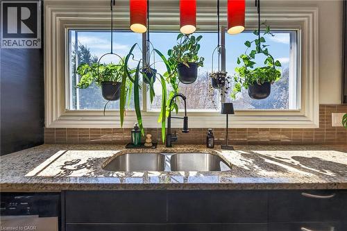 Kitchen view of dark stone counters and stainless steel dishwasher - 844 Upper Wellington Street, Hamilton, ON - Indoor Photo Showing Kitchen With Double Sink