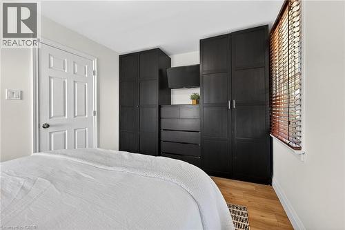 Bedroom with baseboards and light wood finished floors - 844 Upper Wellington Street, Hamilton, ON - Indoor Photo Showing Bedroom