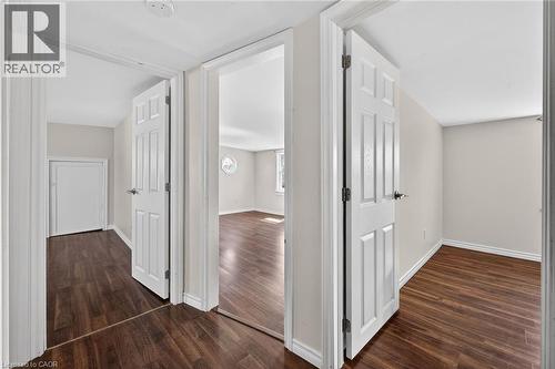 Hallway with baseboards and dark wood finished floors - 844 Upper Wellington Street, Hamilton, ON - Indoor Photo Showing Other Room