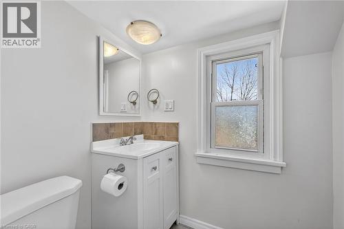 Half bathroom with toilet and vanity - 844 Upper Wellington Street, Hamilton, ON - Indoor Photo Showing Laundry Room