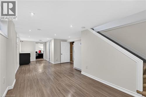 Unfurnished living room with dark wood finished floors and recessed lighting - 844 Upper Wellington Street, Hamilton, ON - Indoor Photo Showing Other Room