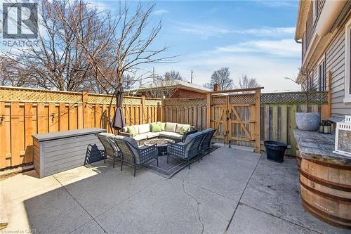 Fenced backyard featuring an outdoor living space, a patio area, and a gate - 844 Upper Wellington Street, Hamilton, ON - Outdoor