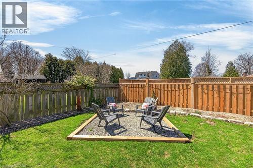 Fenced backyard featuring an outdoor fire pit - 844 Upper Wellington Street, Hamilton, ON - Outdoor