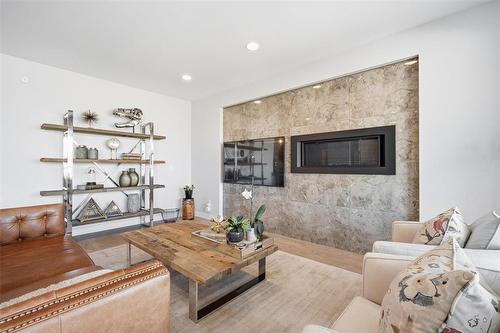 4 Orchard Gate Oak Bluff West - 4 Orchard Gate, Oak Bluff, MB - Indoor Photo Showing Living Room With Fireplace