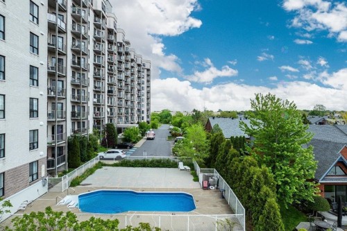 Piscine - 805-7680 Boul. Marie-Victorin, Brossard, QC - Outdoor With In Ground Pool