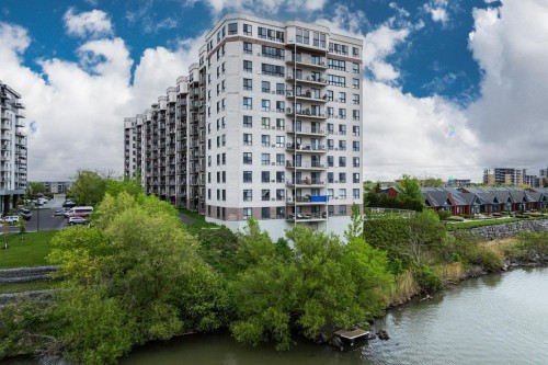 Photo aérienne - 805-7680 Boul. Marie-Victorin, Brossard, QC - Outdoor With Body Of Water With Facade