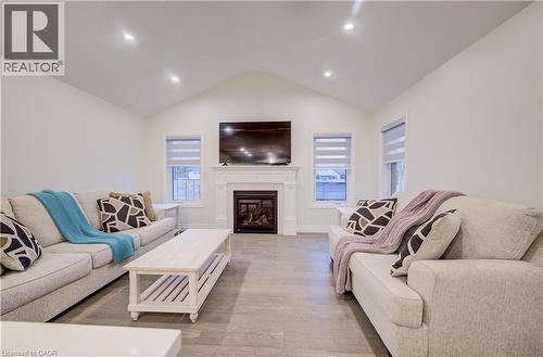 Cathedral Ceiling and LED Pot Lights - 4 Livingston Drive, Tillsonburg, ON - Indoor Photo Showing Living Room With Fireplace