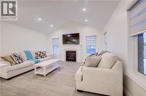 Cathedral Ceiling and LED Pot Lights - 4 Livingston Drive, Tillsonburg, ON - Indoor Photo Showing Living Room With Fireplace