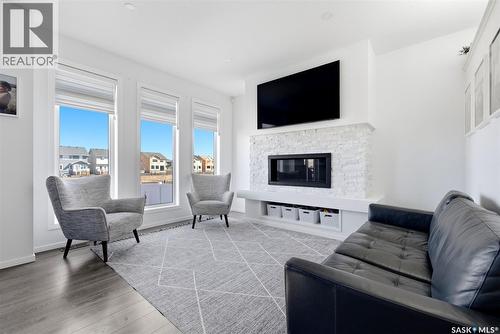 3029 Bellegarde Crescent, Regina, SK - Indoor Photo Showing Living Room With Fireplace