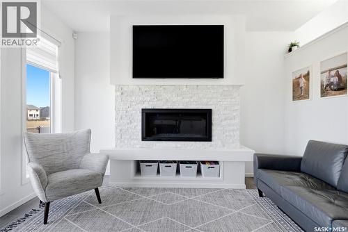3029 Bellegarde Crescent, Regina, SK - Indoor Photo Showing Living Room With Fireplace