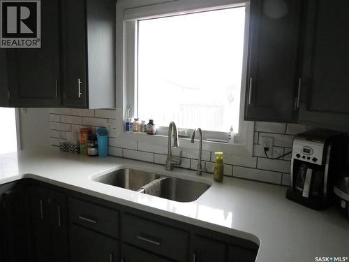 19 Merlin Crescent, Regina, SK - Indoor Photo Showing Kitchen With Double Sink
