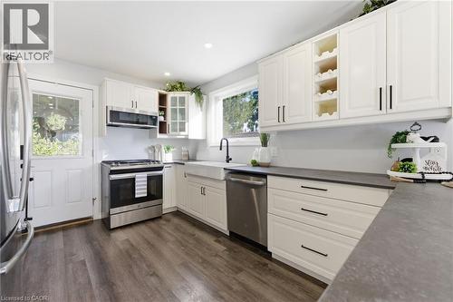 Kitchen featuring open shelves, stainless steel appliances, white cabinets, dark wood-style floors, and recessed lighting - 171 Glencairn Avenue, Hamilton, ON - Indoor Photo Showing Kitchen