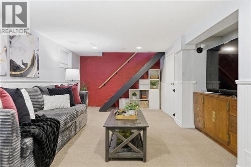 Living room with light carpet and a wainscoted wall - 171 Glencairn Avenue, Hamilton, ON - Indoor