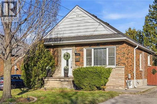 View of front of property featuring brick siding and a front lawn - 171 Glencairn Avenue, Hamilton, ON - Outdoor