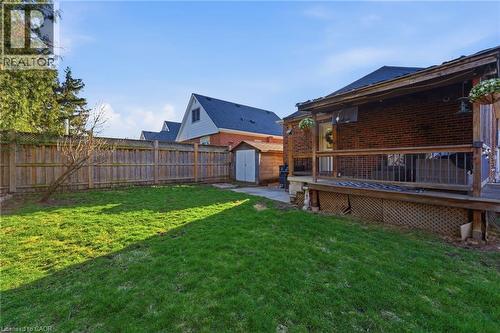 Fenced backyard with a storage unit, a wooden deck, and a patio area - 171 Glencairn Avenue, Hamilton, ON - Outdoor With Deck Patio Veranda