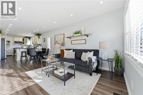 Living area with dark wood-type flooring and recessed lighting - 171 Glencairn Avenue, Hamilton, ON - Indoor Photo Showing Living Room