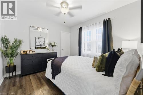 Bedroom featuring dark wood-style flooring and a ceiling fan - 171 Glencairn Avenue, Hamilton, ON - Indoor Photo Showing Bedroom