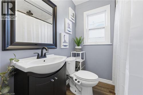 Full bath featuring vanity, wood finished floors, and curtained shower - 171 Glencairn Avenue, Hamilton, ON - Indoor Photo Showing Bathroom