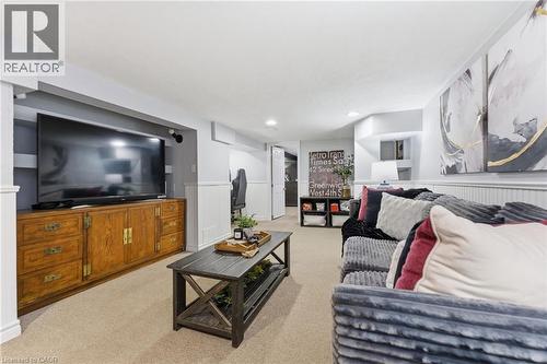 Living area with light colored carpet, wainscoting, and recessed lighting - 171 Glencairn Avenue, Hamilton, ON - Indoor Photo Showing Living Room
