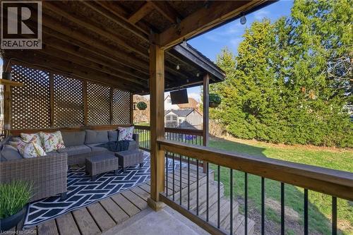Wooden deck featuring outdoor seating, a storage unit, and a lawn - 171 Glencairn Avenue, Hamilton, ON - Outdoor With Deck Patio Veranda With Exterior