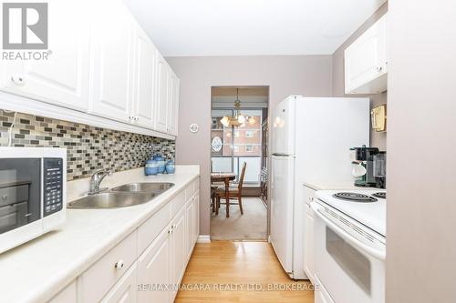 710 - 359 Geneva Street, St. Catharines (Fairview), ON - Indoor Photo Showing Kitchen With Double Sink