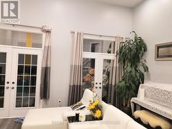 Family Room with Walkout to Covered Balcony - 