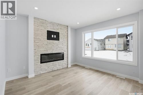262 Kostiuk Crescent, Saskatoon, SK - Indoor Photo Showing Living Room With Fireplace