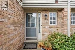 Doorway to property with brick siding - 