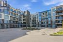 10 Concord Place Unit# 304, Grimsby, ON  - Outdoor With Balcony With Facade 