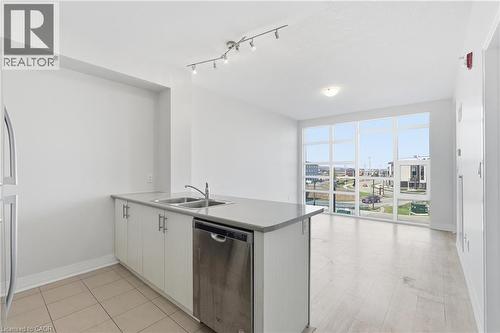 10 Concord Place Unit# 304, Grimsby, ON - Indoor Photo Showing Kitchen With Double Sink