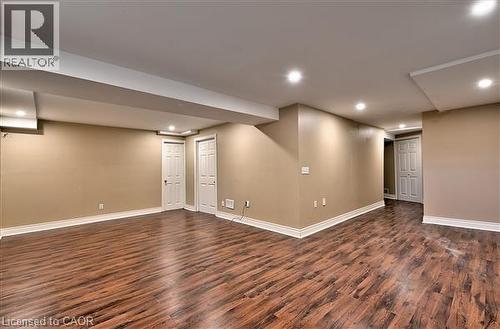 Finished basement featuring recessed lighting and dark wood-style floors - 2215 Tiger Road, Burlington, ON - Indoor