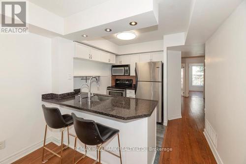 Kitchen W Breakfast Bar & Full Sized Appliances - 761 - 5 Everson Drive, Toronto, ON - Indoor Photo Showing Kitchen