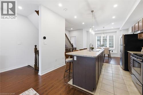 Kitchen island with double sink. - 122 E Dundas Street E Unit# 9, Waterdown, ON - Indoor Photo Showing Kitchen With Upgraded Kitchen