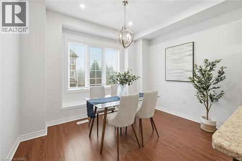 Dining area featuring wood flooring and pot lights - 122 E Dundas Street E Unit# 9, Waterdown, ON - Indoor Photo Showing Dining Room