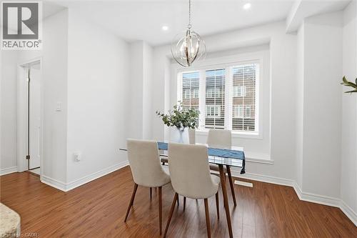 Bright windows providing abundant natural light. - 122 E Dundas Street E Unit# 9, Waterdown, ON - Indoor Photo Showing Dining Room