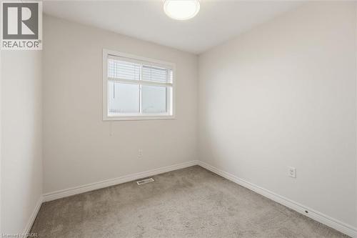 Window and closet - 122 E Dundas Street E Unit# 9, Waterdown, ON - Indoor Photo Showing Other Room