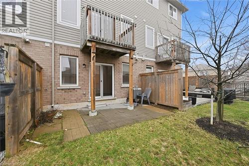 Back of property featuring a fenced backyard, a patio area, a balcony. - 122 E Dundas Street E Unit# 9, Waterdown, ON - Outdoor