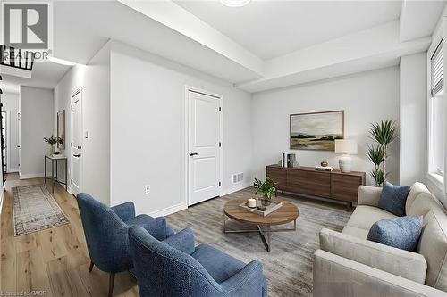 Virtual staging for illustration purposes. - 122 E Dundas Street E Unit# 9, Waterdown, ON - Indoor Photo Showing Living Room