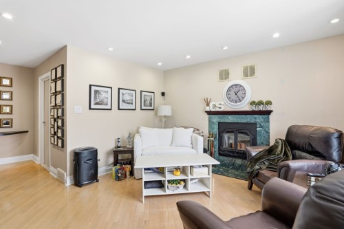 Salon - 320 Rue Brion, Saint-Amable, QC - Indoor Photo Showing Living Room With Fireplace