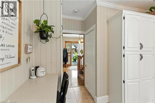 Hall with crown molding, a textured ceiling, and vinyl plank flooring - 98 Kensington Avenue S, Hamilton, ON - Indoor Photo Showing Other Room