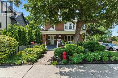 Traditional style home featuring brick and a porch - 98 Kensington Avenue S, Hamilton, ON - Outdoor With Deck Patio Veranda