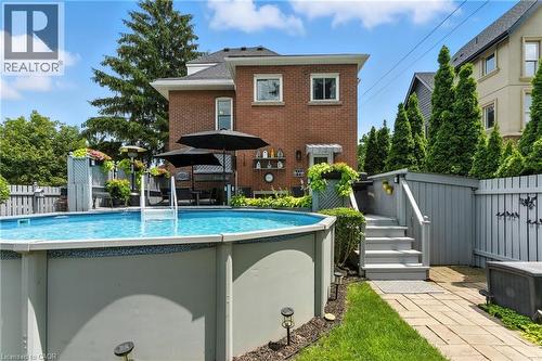 View of swimming pool featuring patio surround - 98 Kensington Avenue S, Hamilton, ON - Outdoor With Above Ground Pool With Exterior