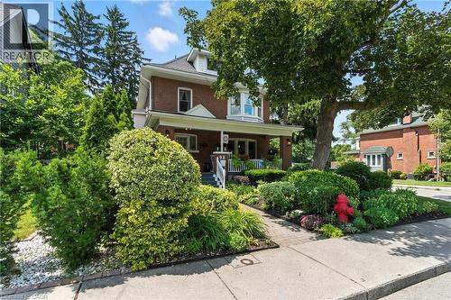 Traditional style home featuring a porch and garden - 98 Kensington Avenue S, Hamilton, ON - Outdoor With Deck Patio Veranda
