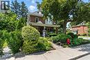Traditional style home featuring a porch and garden - 98 Kensington Avenue S, Hamilton, ON  - Outdoor With Deck Patio Veranda 