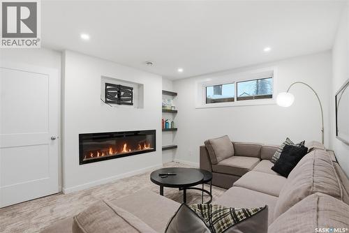 512 7Th Street E, Saskatoon, SK - Indoor Photo Showing Living Room With Fireplace