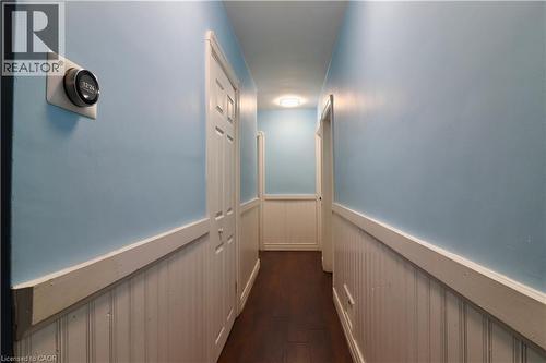 Corridor featuring a wainscoted wall and dark wood-style floors - 80 Roseview Avenue, Cambridge, ON - Indoor Photo Showing Other Room